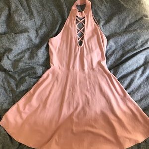 Pink halter dress with criss cross detail on front